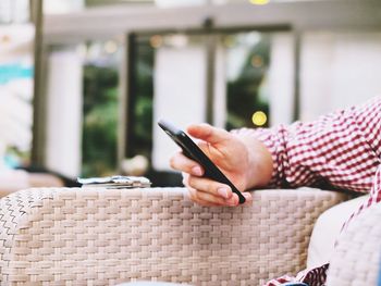 Close-up of woman using mobile phone