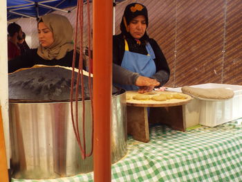 Woman standing by a restaurant