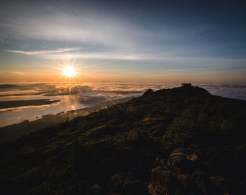 Sunrise over a misty flagstaff lake from summit of bigelow mountain.