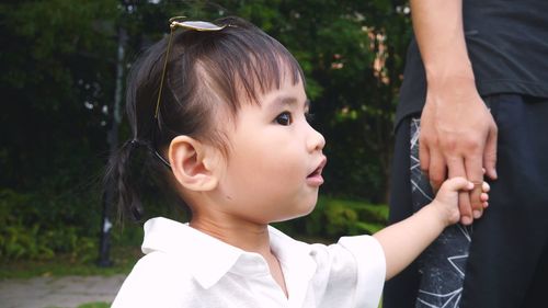 Portrait of cute girl looking down