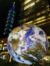 Low angle view of illuminated building at night