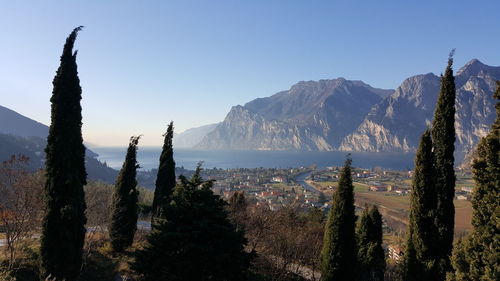 Panoramic view of trees and mountains against sky