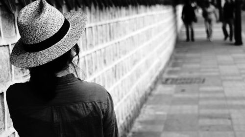 Rear view of woman in hat