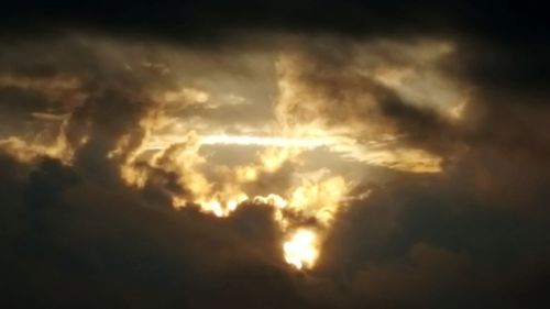 Low angle view of clouds in sky during sunset