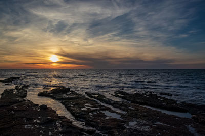 Scenic view of sea against sky during sunset