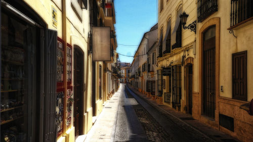 Narrow alley amidst buildings in city