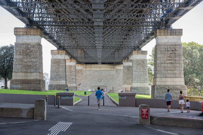 People walking on bridge