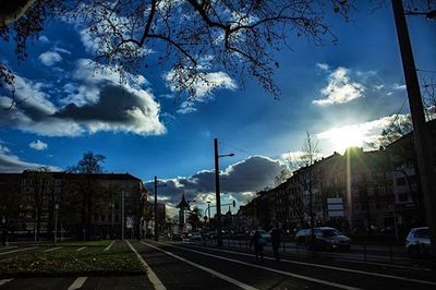 City street against cloudy sky