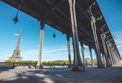 Low angle view of tower bridge against sky eiffel tower