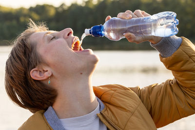 Young man drinking water