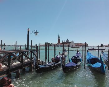 View of boats moored in canal