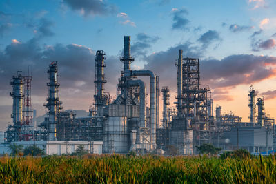 View of factory against cloudy sky