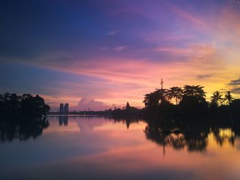 Scenic view of lake against romantic sky at sunset