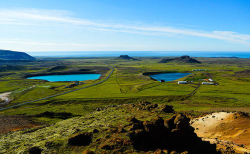 Scenic view of landscape and sea against sky