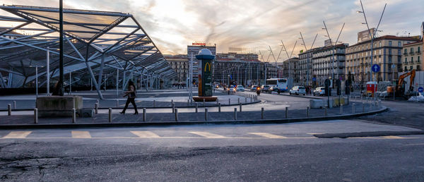 City street by buildings against sky