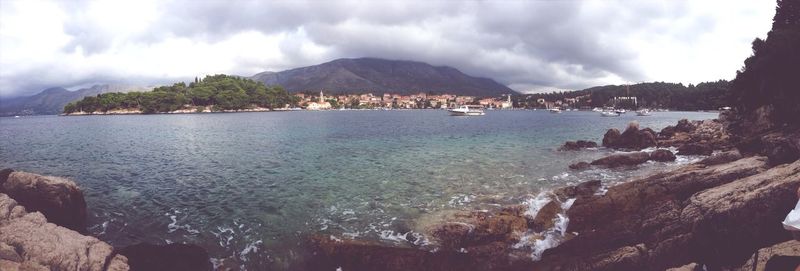 Scenic view of mountains against cloudy sky