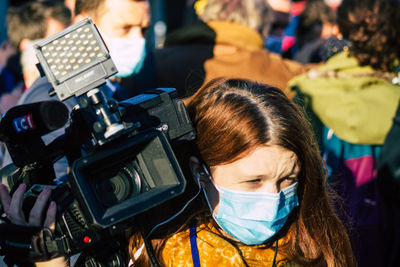 Portrait of woman photographing