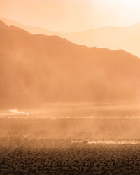 Scenic view of landscape against sky during sunset