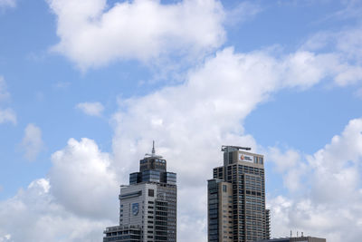 Low angle view of modern buildings against sky