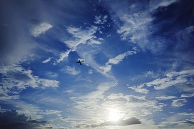 Low angle view of airplane flying in sky