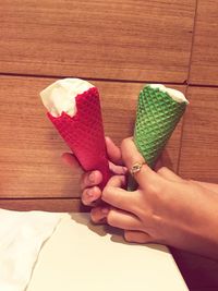 Person holding ice cream cones