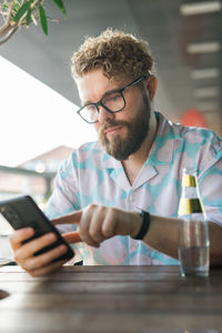 Young man using mobile phone