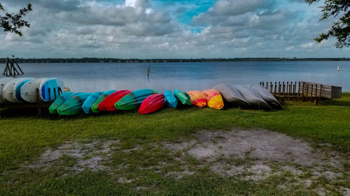 Multi colored umbrellas on beach against sky