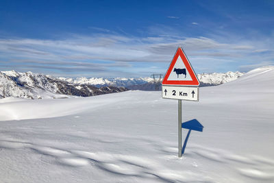 Scenic view of snow covered mountain against sky
