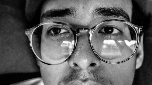 Close-up of man looking away while wearing eyeglasses