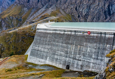 Grande dixence dam in swiss alps. the tallest gravity dam. high angle view of dam on mountain