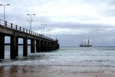 Pier over sea against sky