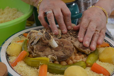 High angle view of person preparing food on table