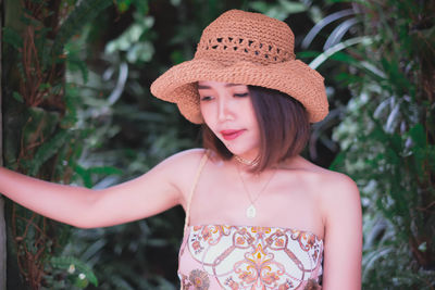 Portrait of a beautiful young woman wearing hat