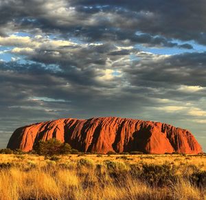 Rock formations on landscape against sky