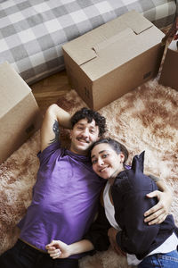 Young couple lying down together