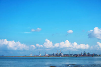 Scenic view of sea against blue sky