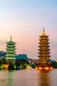 View of illuminated building against sky