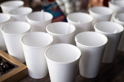 A group of empty coffee cups to serve tea or coffee at an event buffet