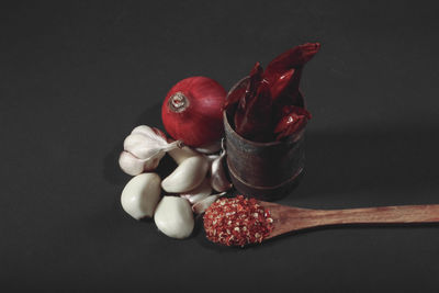 Close-up of strawberries on table against black background