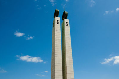 Low angle view of tower against cloudy sky