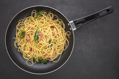 High angle view of noodles in frying pan