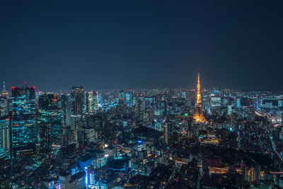 Illuminated buildings in city at night