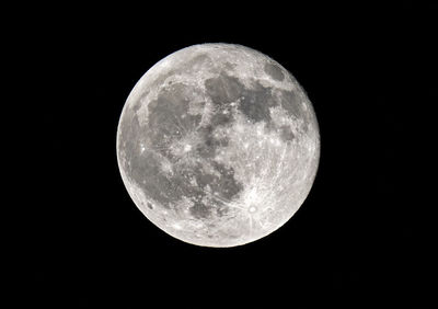 Low angle view of moon against sky at night