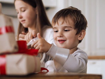 Portrait of cute girl playing with toy at home