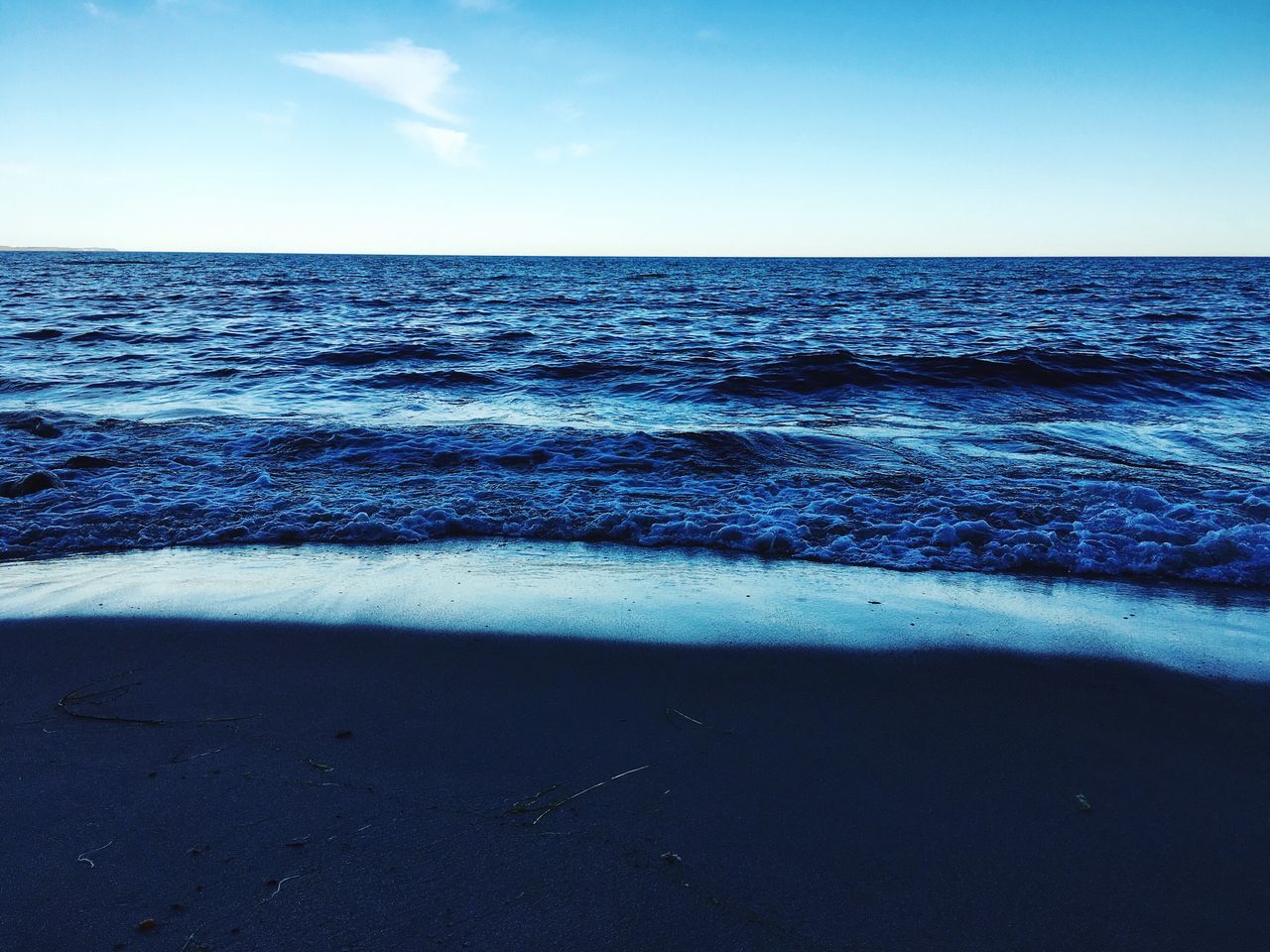 sea, water, horizon over water, blue, tranquil scene, scenics, beauty in nature, tranquility, nature, wave, seascape, sky, rippled, idyllic, calm, ocean, outdoors, no people, day, coastline, remote, non-urban scene, travel destinations, non urban scene, majestic, tourism