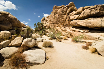 Rock formations in desert against sky