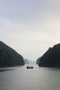 Boats sailing in sea