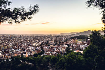 High angle view of townscape against sky at sunset