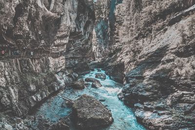 View of rock formations in water