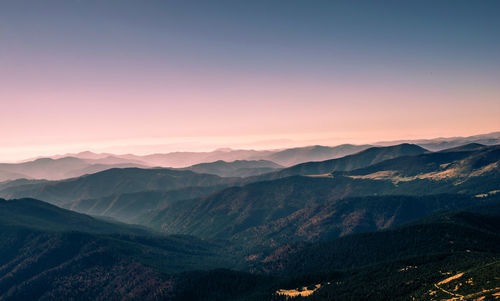 Scenic view of mountains against sky during sunset